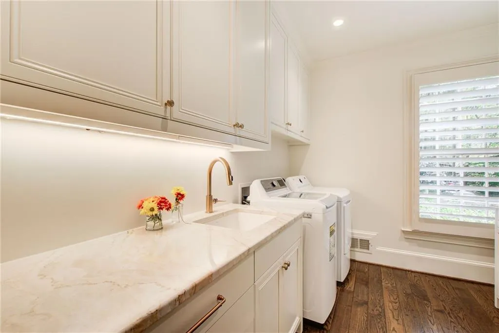 The laundry-mud room  is beside the garage with custom cabinetry, quartz countertops and a deep  sink. Lots of beautiful light too. The laundry-mud room  is beside the garage with custom cabinetry, quartz countertops and a deep  sink. Lots of beautiful light too.
