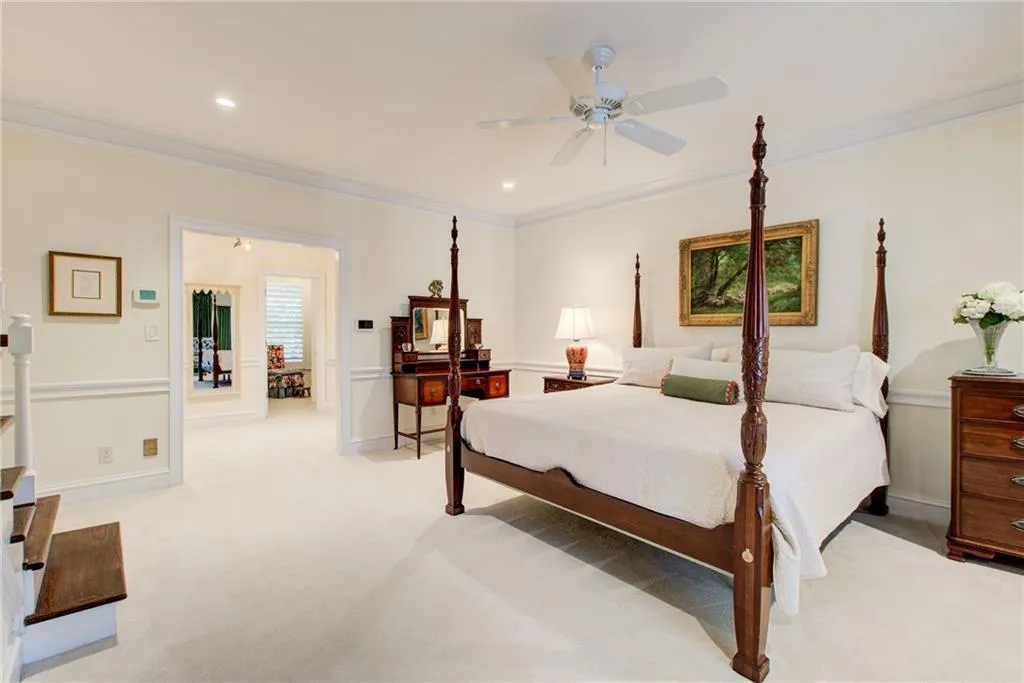 Primary bedroom on the main level with 2 closets, a dressing room  and spacious bathroom Primary bedroom on the main level with 2 closets, a dressing room  and spacious bathroom
