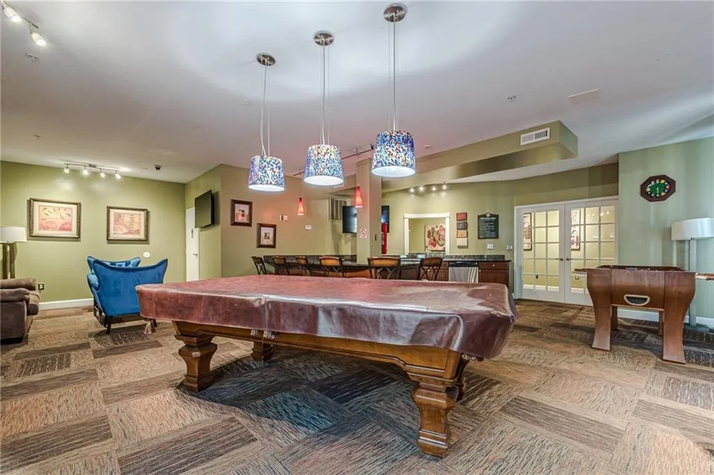 Game room with pool table, french doors, track lighting, and carpet flooring
