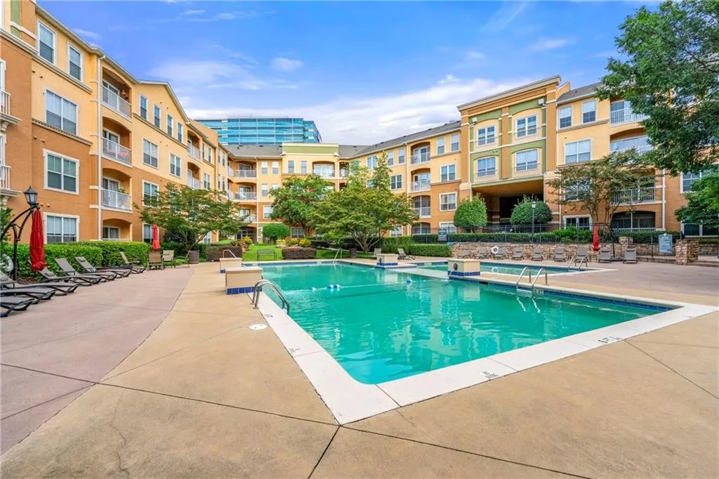 Community pool featuring a patio