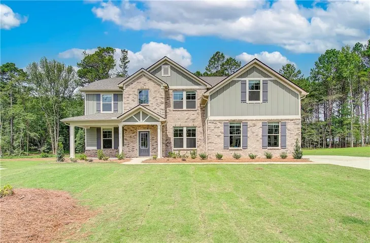 Craftsman-style house featuring a front lawn