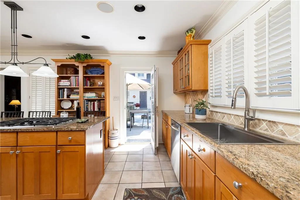 Kitchen has direct access to the backyard and deck