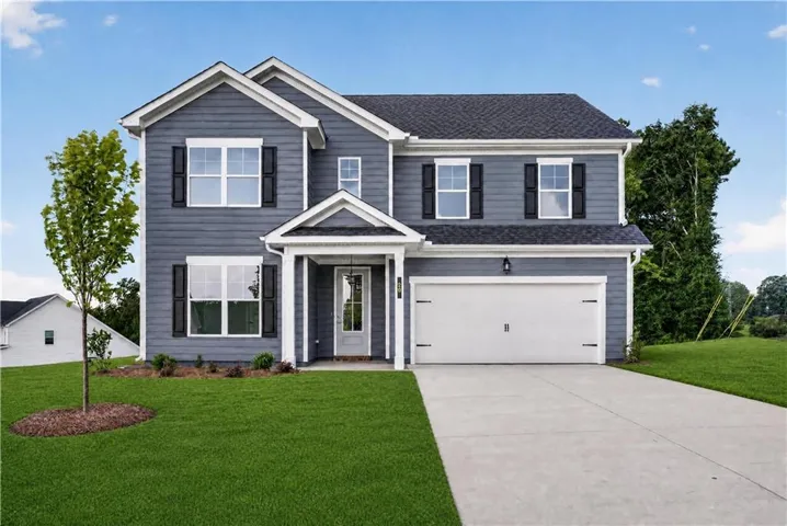 Two-story residence featuring blue siding with white trim, a gabled roofline, and a prominent front entry porch