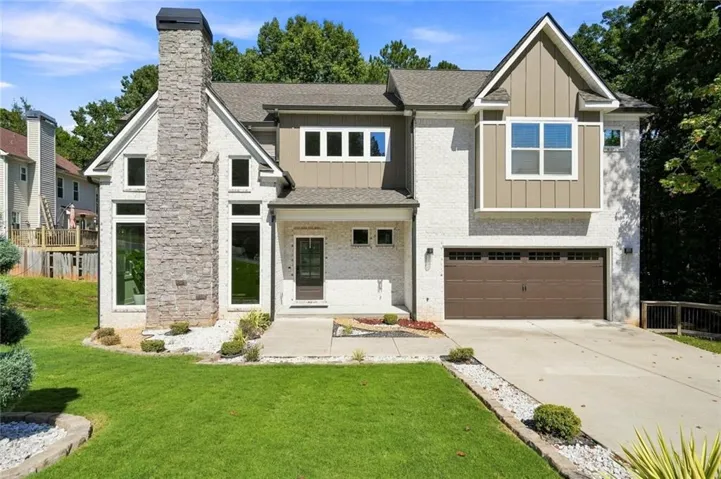 Two-story exterior with stucco and vertical siding accents