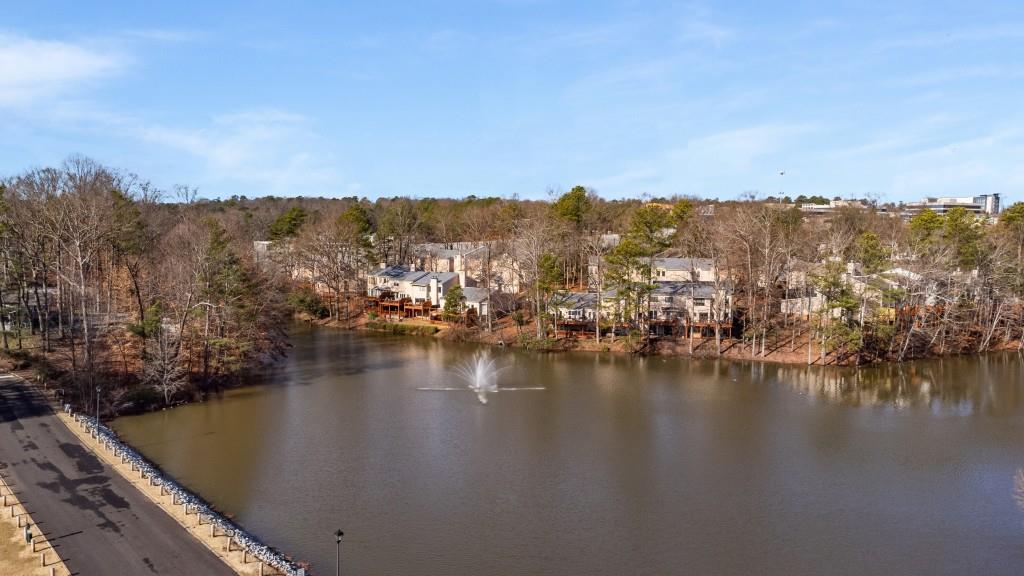 Amenities include a clubhouse, a pool overlooking the lake, tennis courts, & a fitness center.