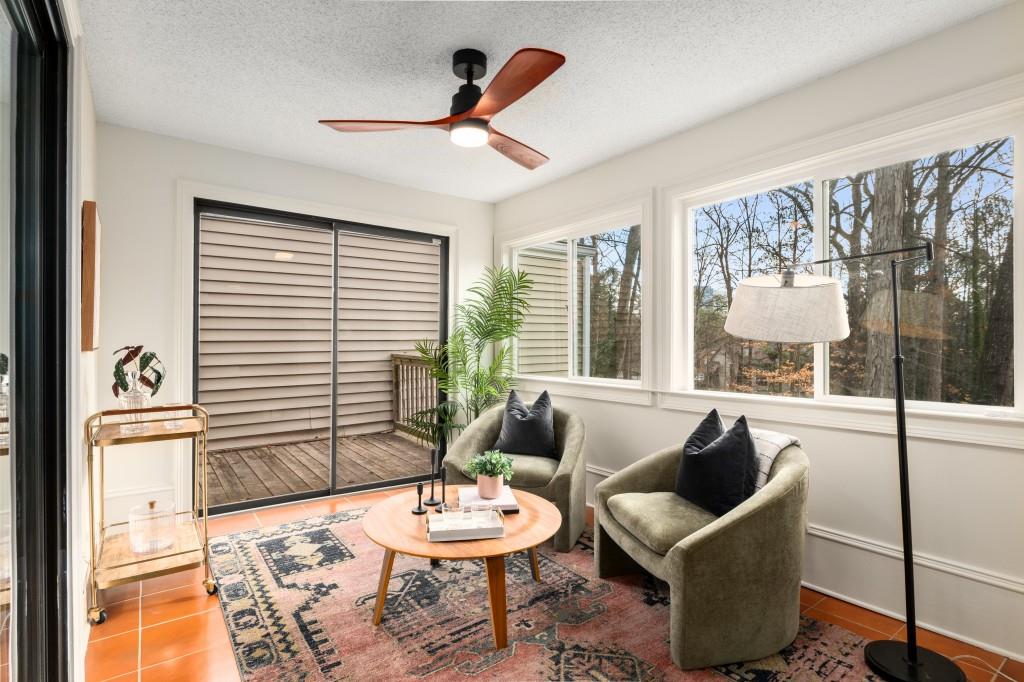 Adjacent to the living area, discover the sunroom, a versatile space flooded with natural light.