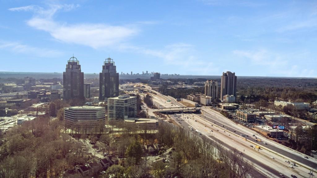 Amenities include a clubhouse, a pool overlooking the lake, tennis courts, & a fitness center.