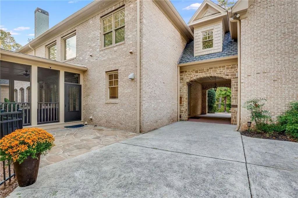 Covered drive-thru between the house and garage Covered drive-thru between the house and garage