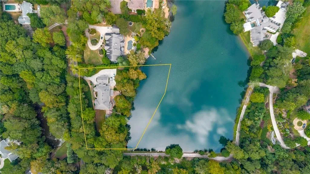 Only 5 homes on this 7ac lake!