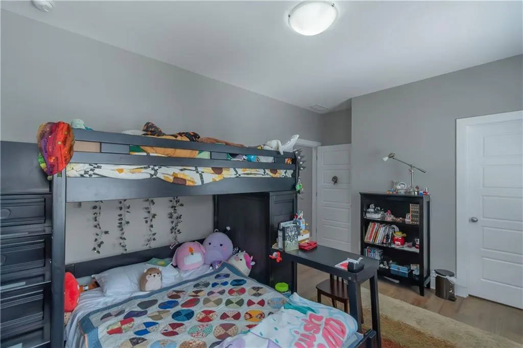 Bedroom with wood finished floors