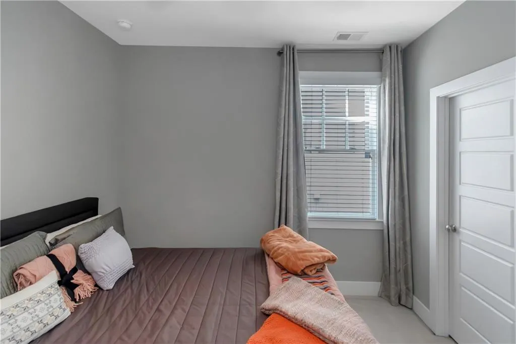 Bedroom featuring visible vents