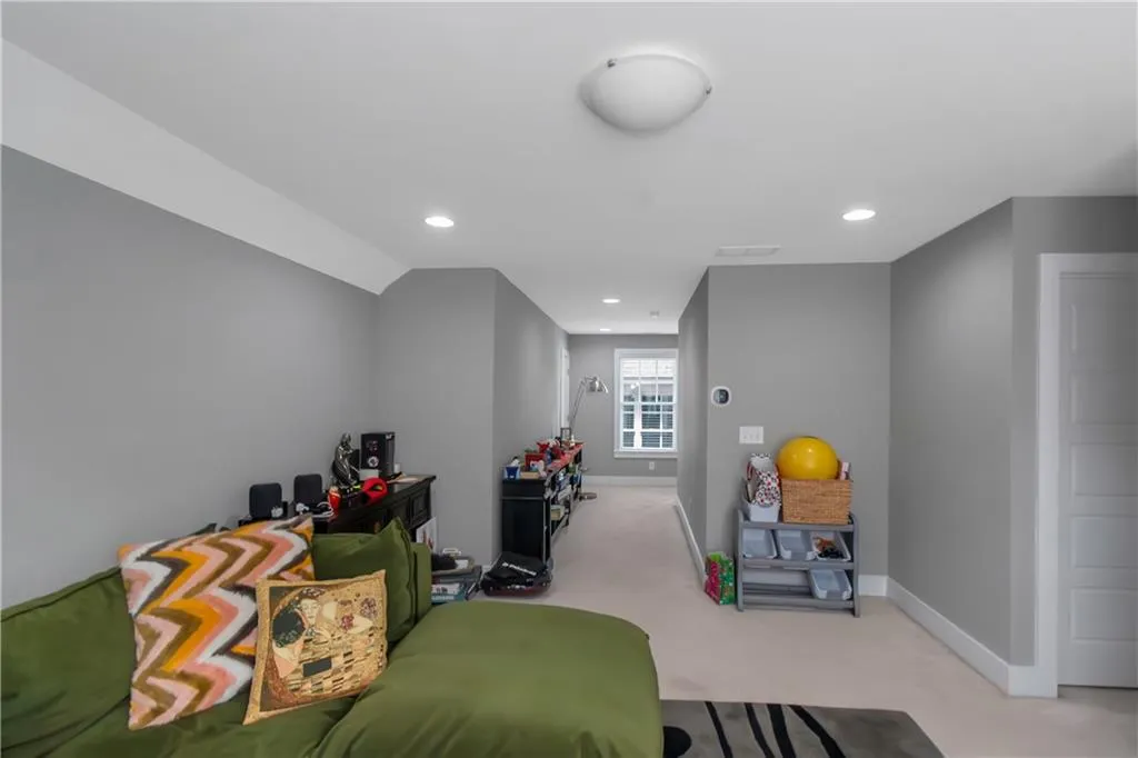 Playroom with recessed lighting, baseboards, and light colored carpet