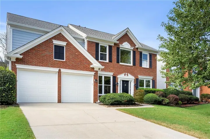 Brick exterior with a gabled roof and white trim