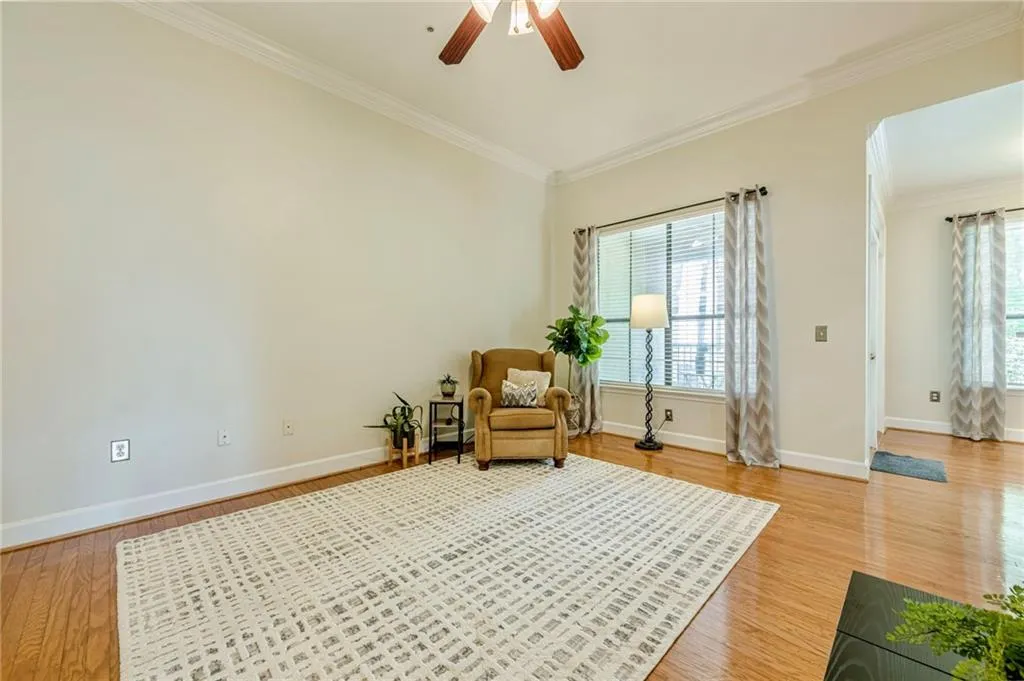 light wood finished floors, and ceiling fan