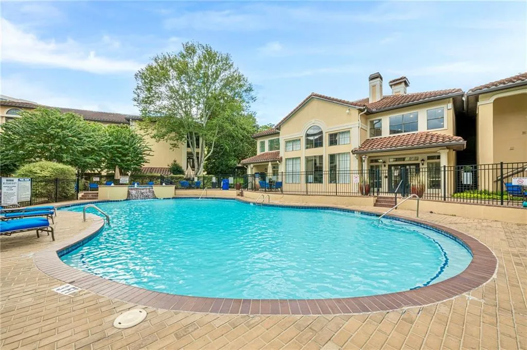 Community pool featuring a patio area