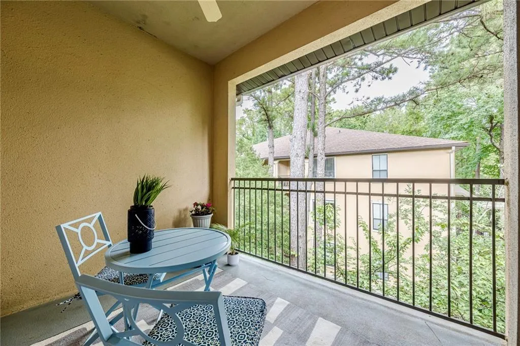 Balcony featuring ceiling fan