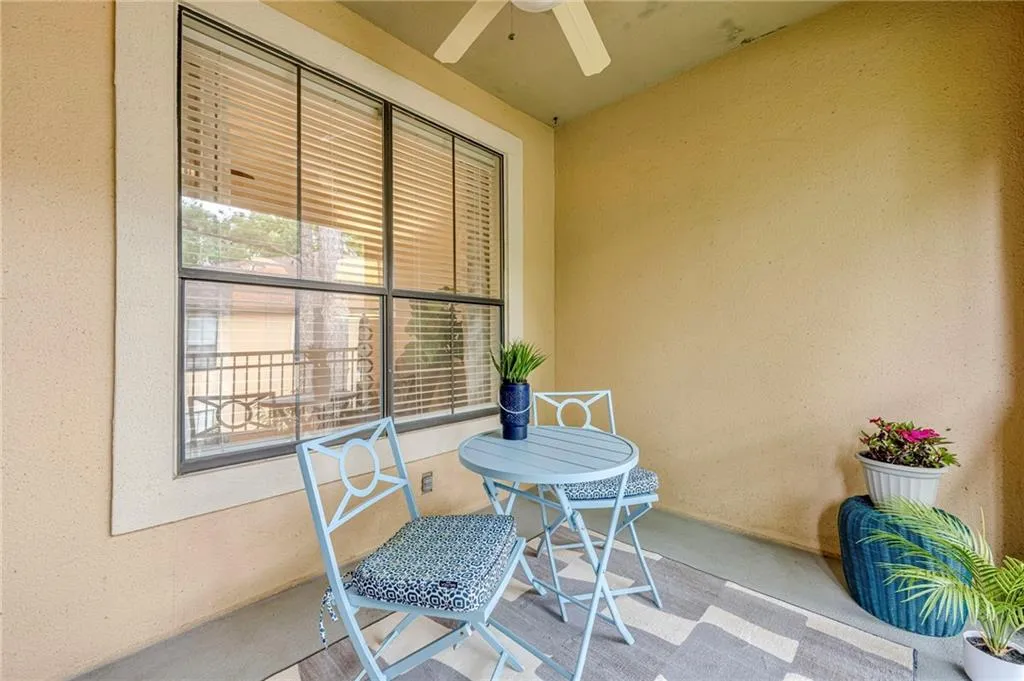 Patio / terrace featuring ceiling fan