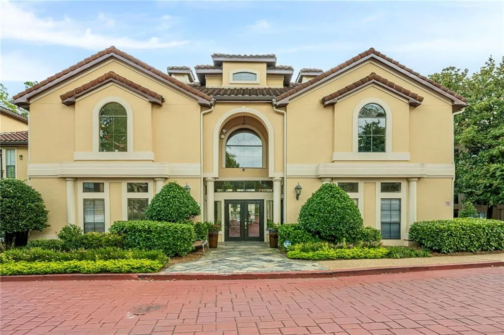Mediterranean / spanish house featuring stucco siding, french doors, and a tile roof