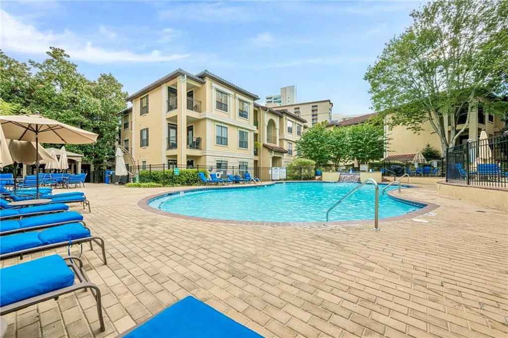 Community pool featuring a patio