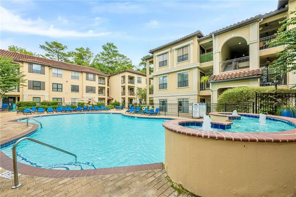 Community pool with a patio area