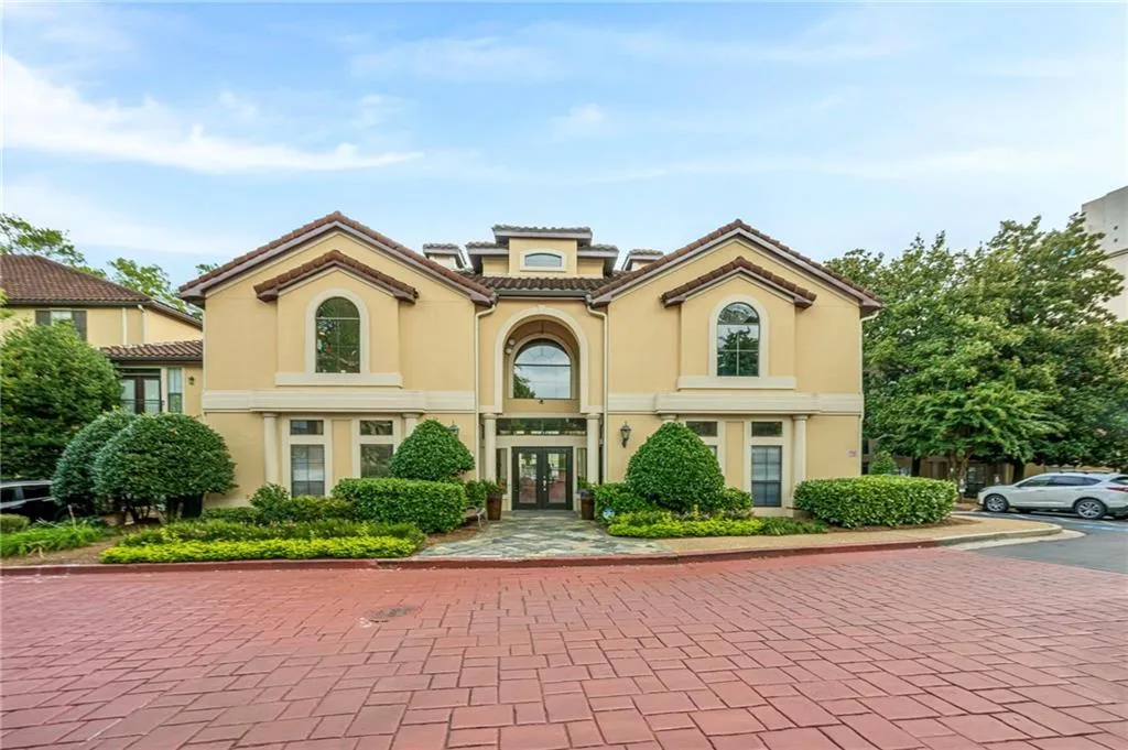 Mediterranean / spanish home with french doors, stucco siding, and a tiled roof
