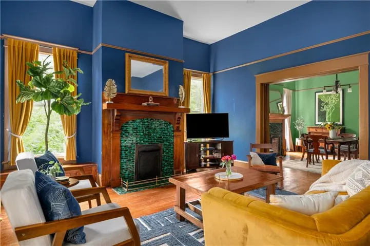 Living area featuring a fireplace and wood finished floors