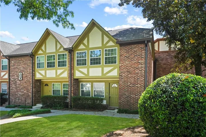 Brick and stucco exterior with gabled roofs