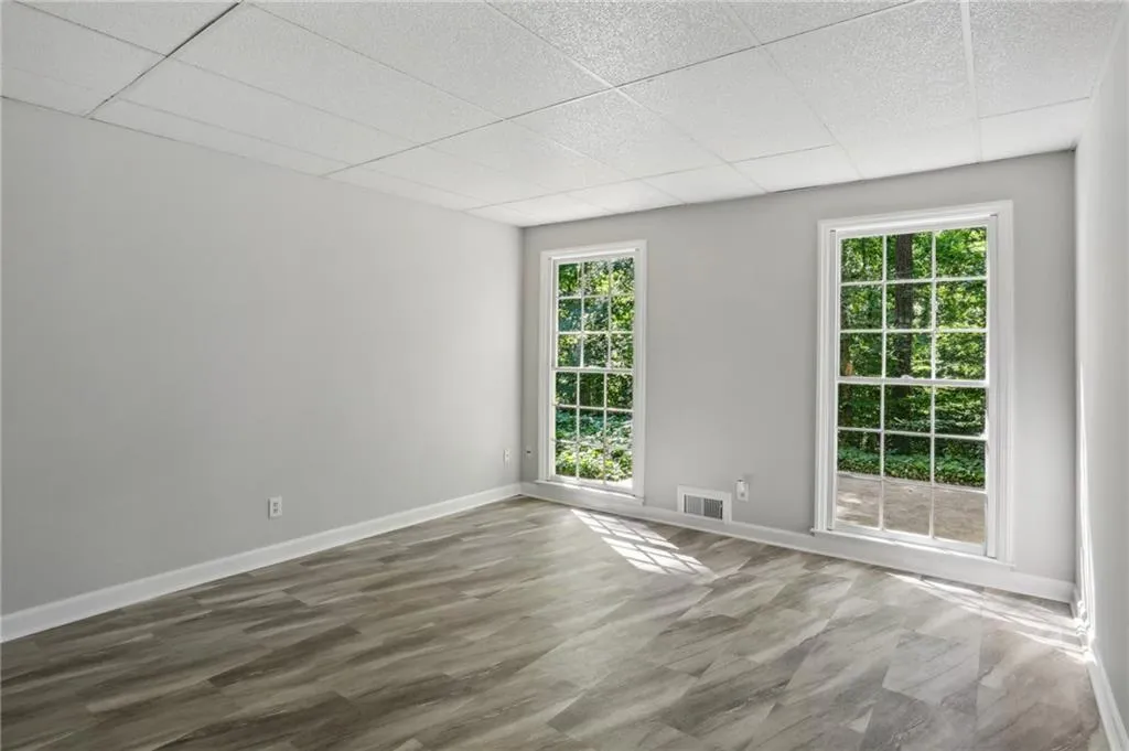 Terrace level bedroom or office with floor to ceiling windows.