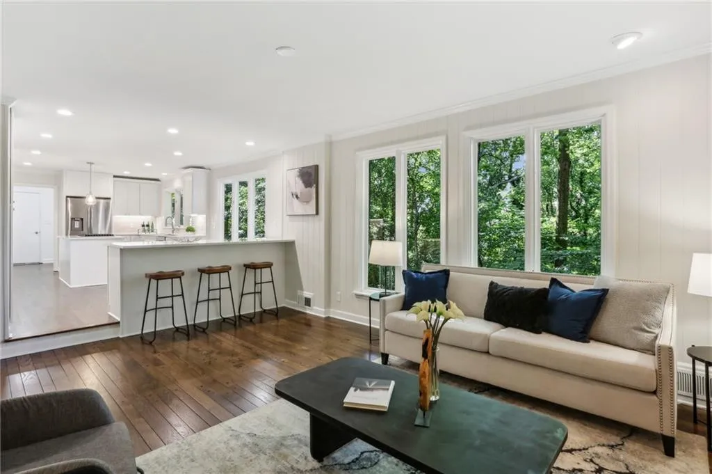 View of Family room showing counter seating open to kitchen.