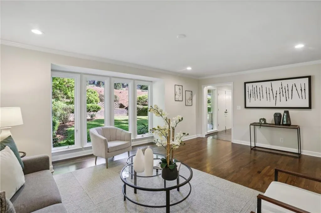 Another view of Living room showing front yard, foyer and front doors