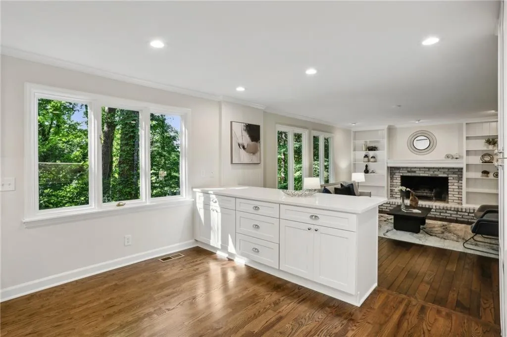 Open floorplan from kitchen to Family room offering ample space for table and chairs.