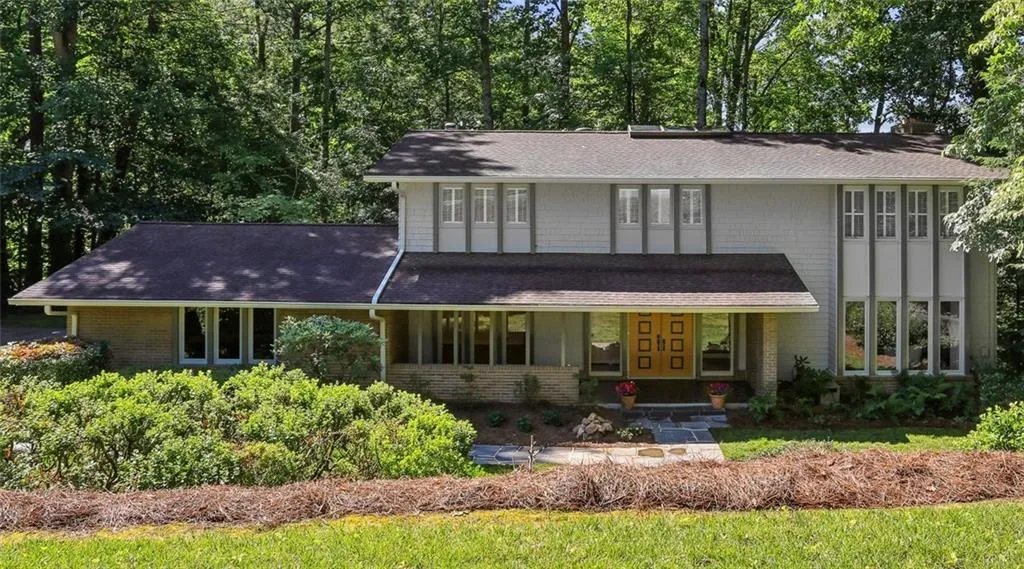 Mature landscaping, privacy and tons of windows.