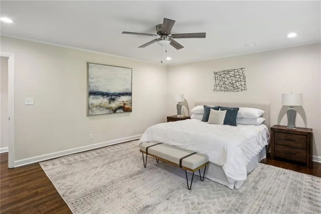 Primary Bedroom view from corner showing king size bed.