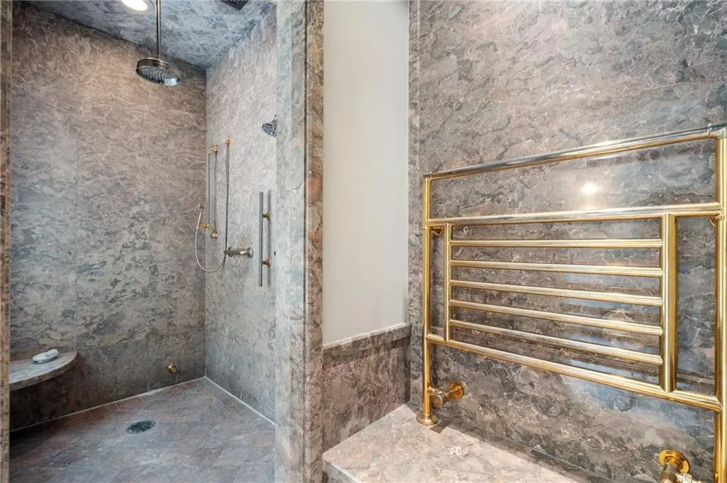 Huge steam shower with heated towel rack.