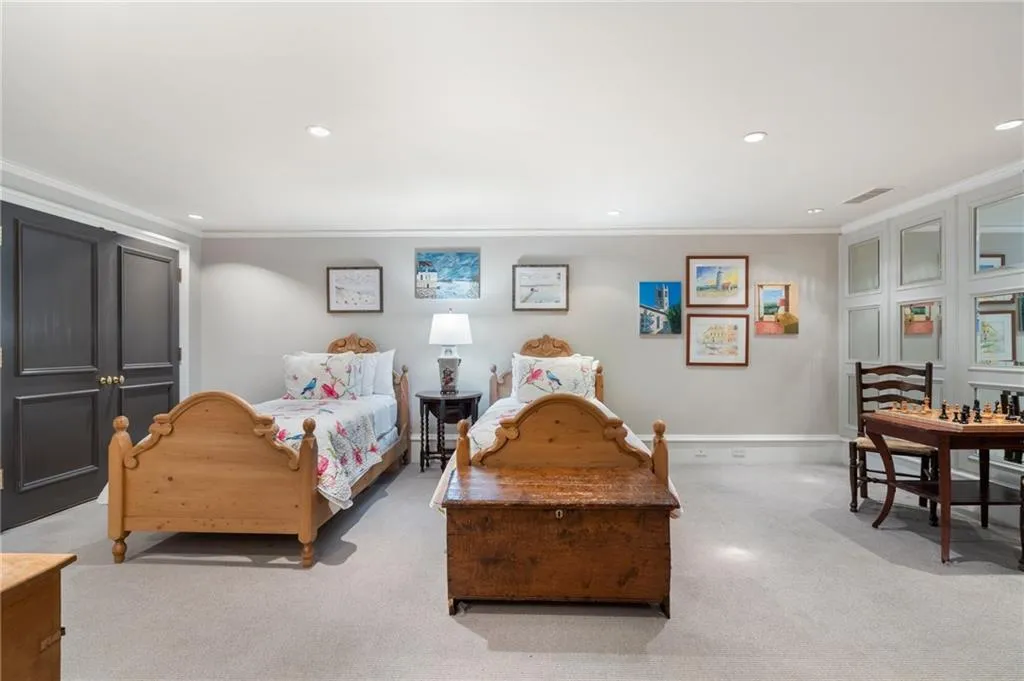 Downstairs bedroom. There is an office in one of the closets and kitchenette in the other.