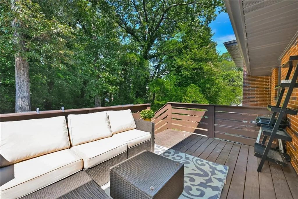 Wooden terrace featuring an outdoor hangout area