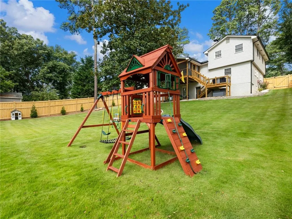 View of jungle gym featuring a yard