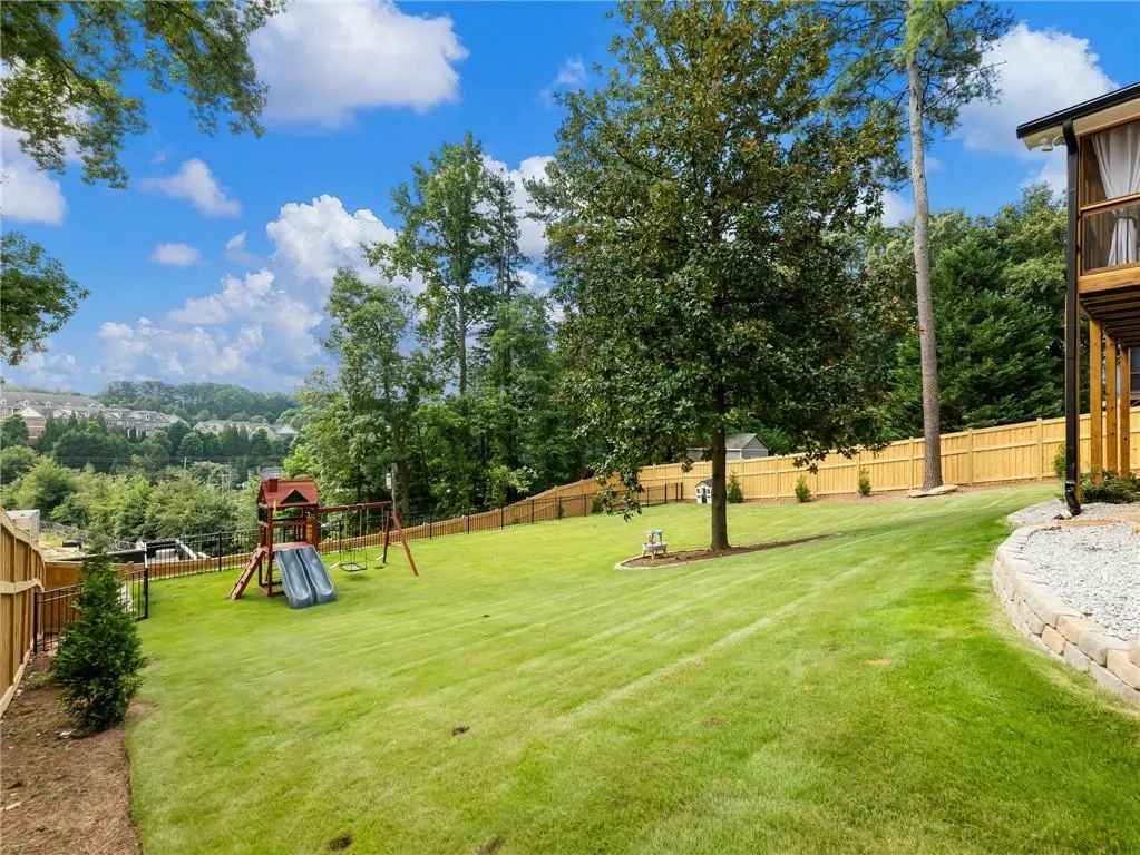 View of yard featuring a playground