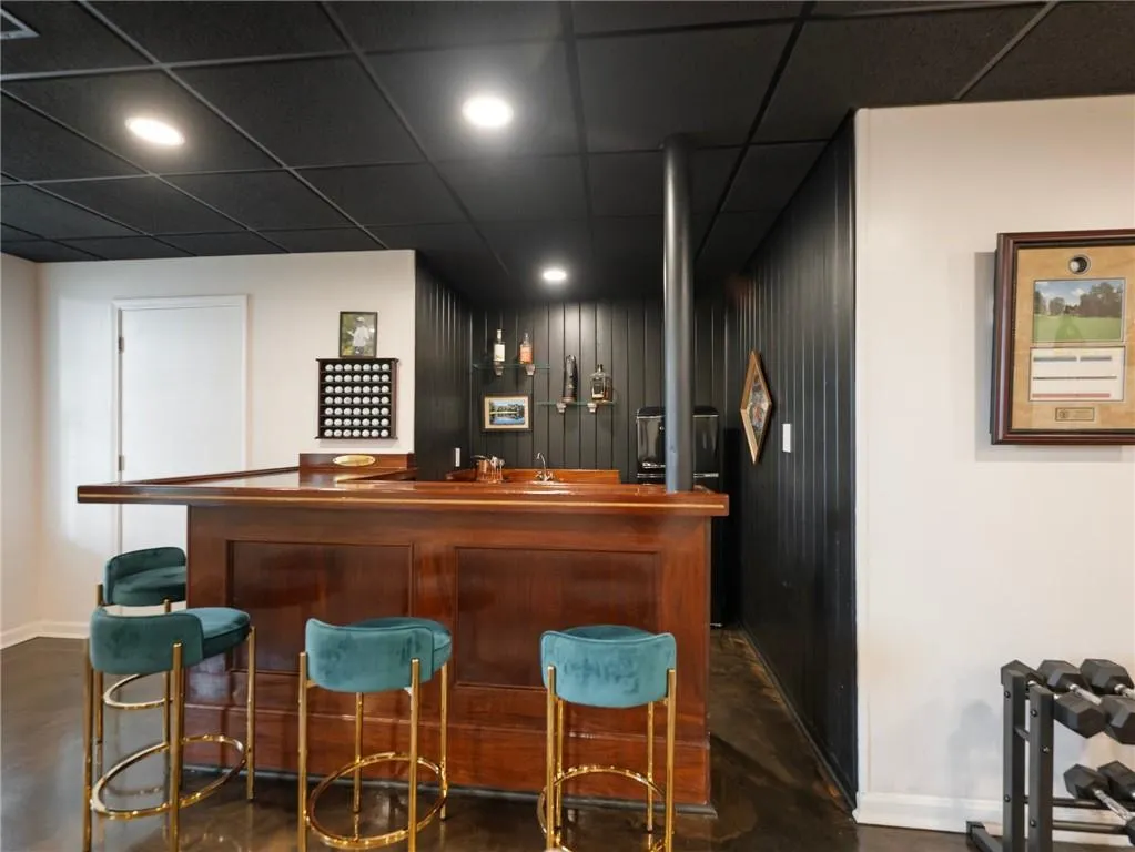Bar featuring a paneled ceiling