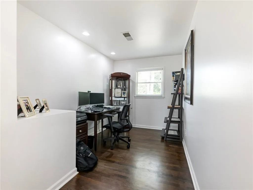 Office featuring dark wood-type flooring