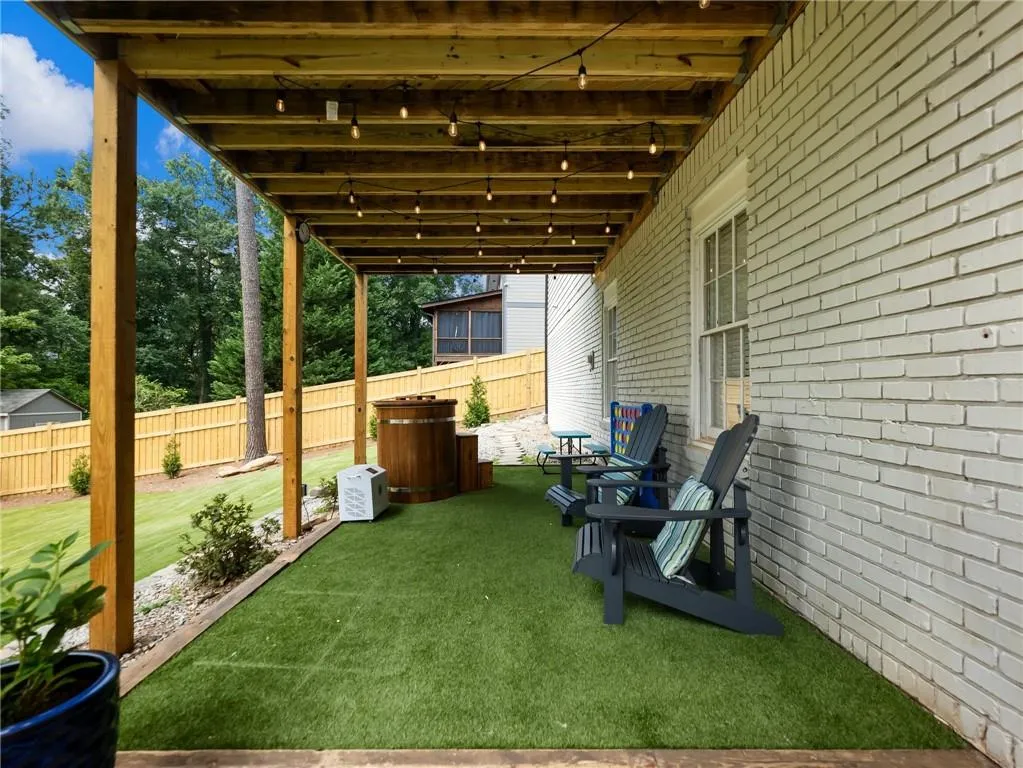 View of yard with a hot tub