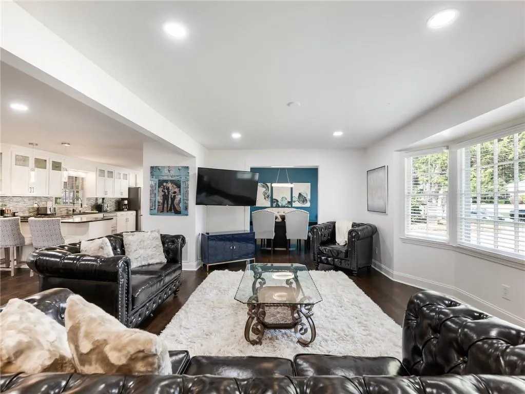 Living room featuring dark hardwood / wood-style flooring