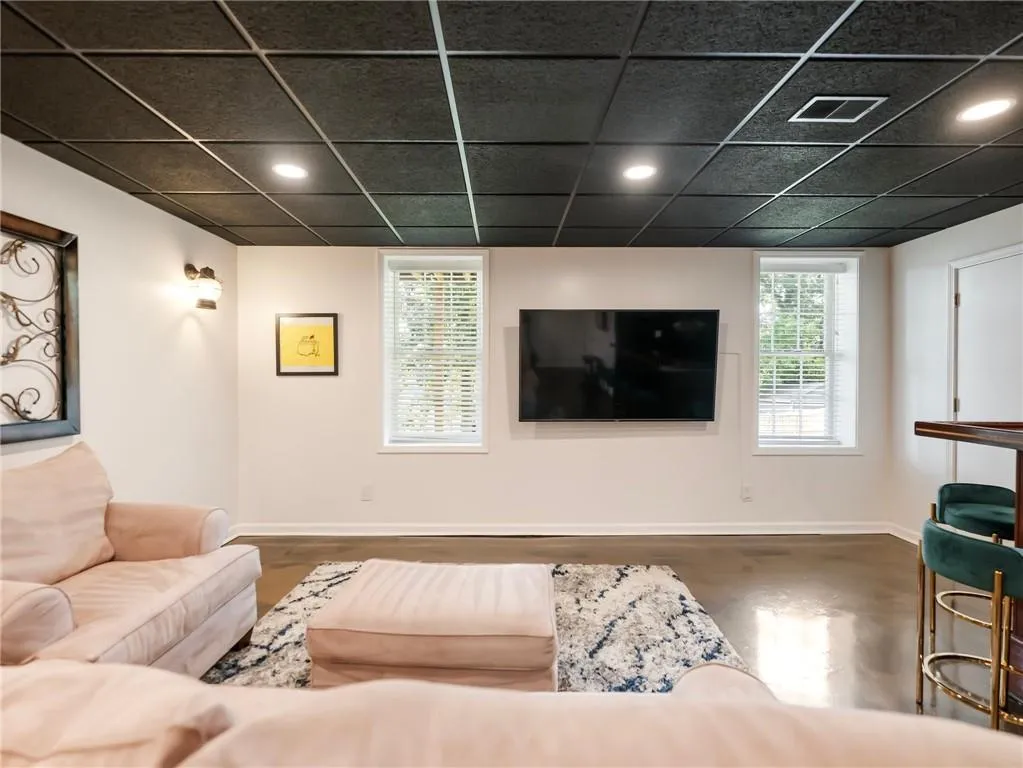 Living room featuring a drop ceiling