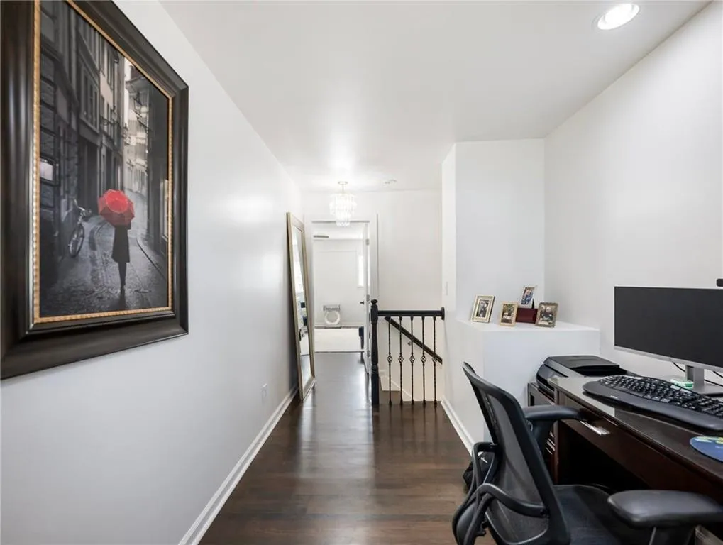 Office space with dark wood-type flooring