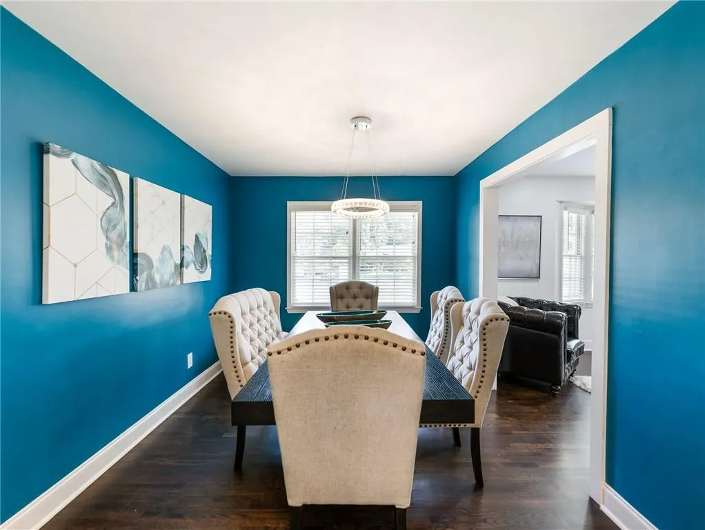 Dining space featuring dark wood-type flooring