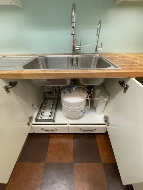 Interior details with sink and wood counters Water filtration system
