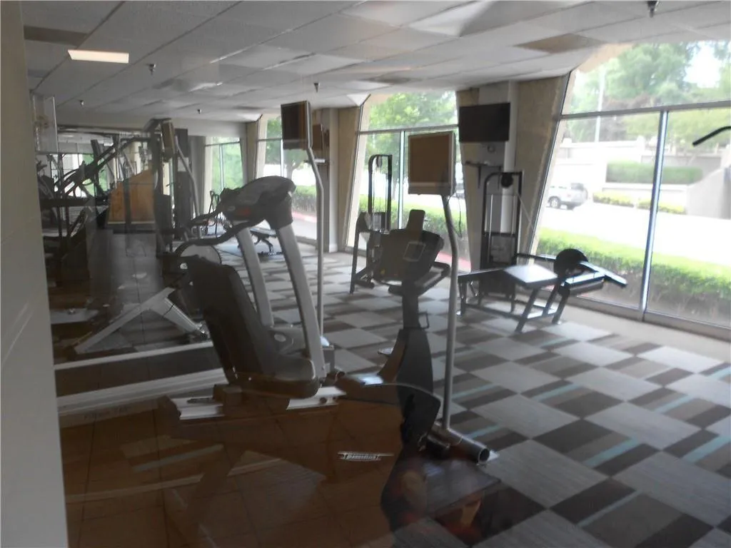 Workout area featuring a paneled ceiling