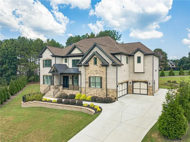Brick and stone exterior with dark trim and shutters