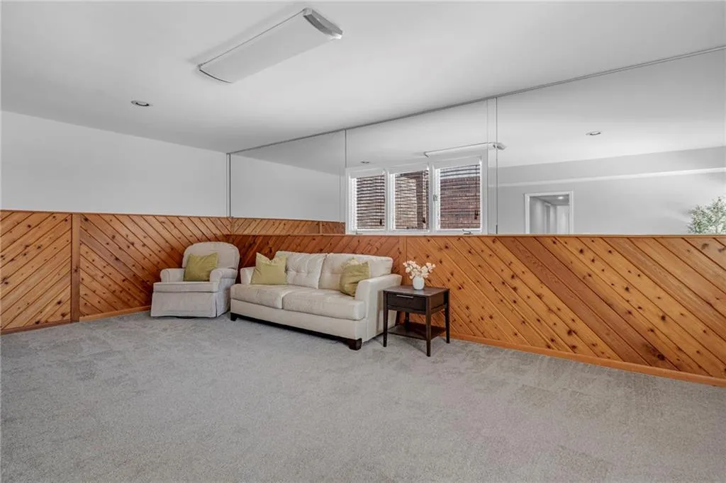 Unfurnished living room featuring light colored carpet