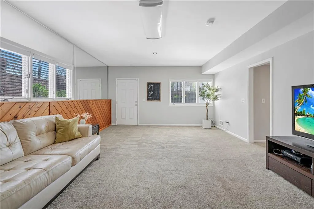 Living room with light colored carpet
